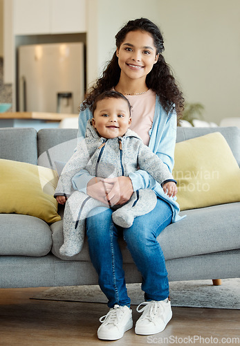 Image of Smile, portrait and mother with baby in living room home, bonding or having fun in house. Mom, newborn and face of happy child on sofa to relax, care or enjoying family time together with happiness.