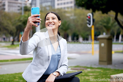Image of Business woman, selfie and travel with commute to work, communication and social media post in city. Young female professional, smile in picture with happiness, technology and urban with mockup space