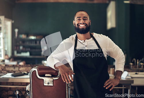 Image of Barber shop, hair stylist smile and black man portrait of an entrepreneur feeling happy. Salon, professional worker and male person face with happiness and proud from small business and beauty parlor