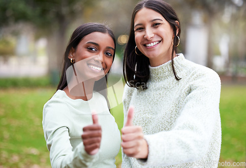 Image of Young women, thumbs up and university students happy for education or yes for academic study or success portrait and on mock up. Agreement, female scholars and smile or achieve in new york campus