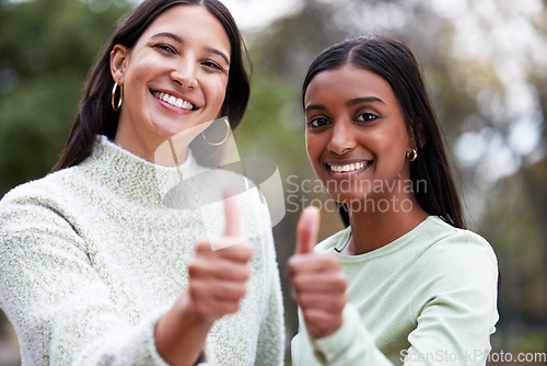 Image of Young women, thumbs up and university students happy for education or success or like their school study as winning friends. Agreement, yes and and female scholars smile for achievement or on campus