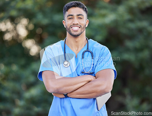 Image of Man, nurse portrait and arms crossed of healthcare and wellness professional outdoor. Success, doctor motivation and nursing male person in nature with a smile from career confidence and work