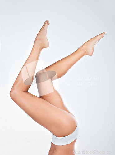 Image of Woman in underwear, legs and feet of hair removal, beauty and skincare of wellness on white background. Female model, natural cosmetics and epilation for grooming, hygiene and cosmetic care in studio