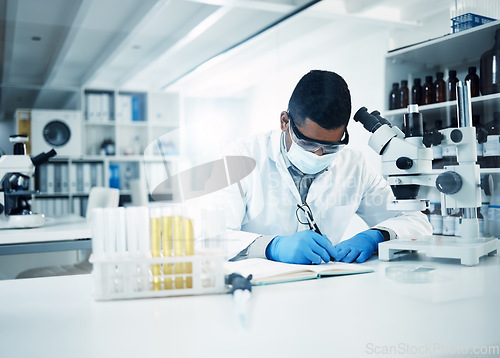 Image of Man, scientist and writing notes in research for discovery, breakthrough innovation and information at lab. Male person, science professional and notebook for scientific data of results in laboratory