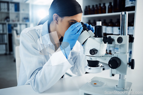 Image of Woman, scientist and microscope, study and analysis, check DNA sample and science experiment in laboratory. Female doctor analyze data, scientific innovation and medical research with knowledge