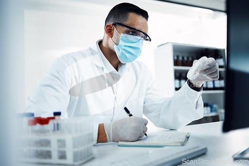 Image of Laboratory, medical research and scientist writing notes while doing an analysis on virus data. Write, face mask and male science researcher working on scientific project at pharmaceutical lab.