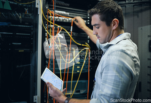 Image of Server room, engineer and man working with a tablet for programming, cybersecurity or cable maintenance. Technician person in a datacenter for network, software or system upgrade with technology app