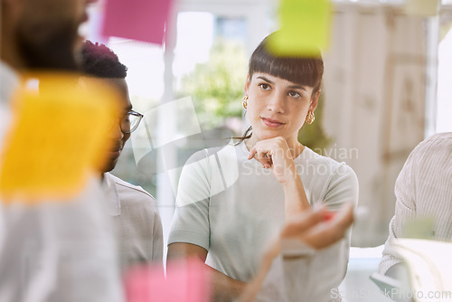 Image of Thinking, planning and business woman for teamwork, brainstorming and project workflow or management goals. Team or people with group ideas, collaboration and solution on glass board or sticky notes