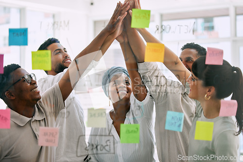Image of High five, business people and sticky notes for success, teamwork and collaboration goals, winning or support. Yes, celebration and happy women, men or team hands together for help or target on glass