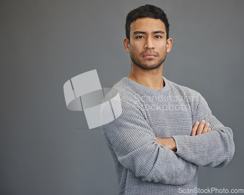 Image of Portrait of man with mockup, arms crossed and serious on studio backdrop in confident casual fashion promo. Relax, confidence and face of male on grey background with focus, pride and mock up space.