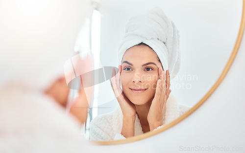 Image of Mirror, woman and hands on face for skincare, check and anti aging cosmetic results in bathroom. Facial, beauty and female touching soft, glow and smooth skin after luxury dermatology routine at home