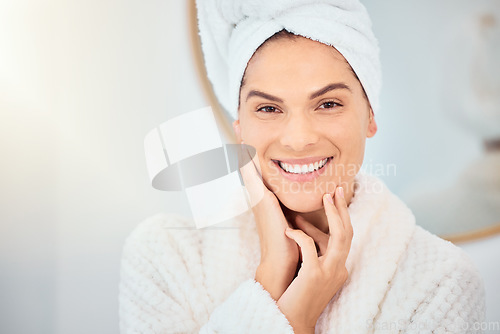 Image of Bathroom, skincare and portrait of happy woman after shower, cleaning and wellness routine in her home. Face smile and female person with hands on soft, glow or smooth skin after cosmetic dermatology