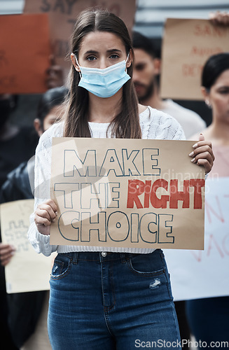 Image of Protest poster, woman and face mask portrait with fight, human rights and rally sign in city. Urban, group and protesting people with a female person holding pro vaccine movement signage on a street