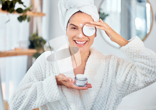 Image of Bathroom, skincare and face cream for woman with cotton, dermatology, and wellness product in the morning at home. Portrait, sunscreen and happy person with facial, skin collagen and beauty lotion
