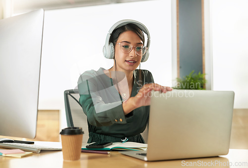 Image of Virtual meeting, business woman and laptop with video call with headphones and pc. Worker, working and female employee with webinar at a company with computer and digital communication at office