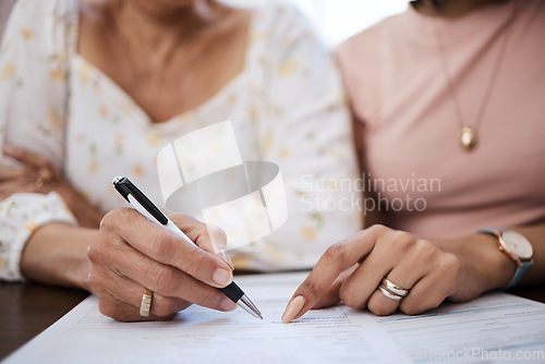 Image of Document, pen and closeup of a woman signing a retirement contract or application with a pen. Zoom of a female person with signature for pension paperwork, form or agreement with professional lawyer.