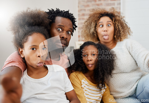 Image of African family, selfie and funny face in portrait at home with bond, care or relax with social media app. Happy father, mother and daughters together for profile picture, comic photography and joke