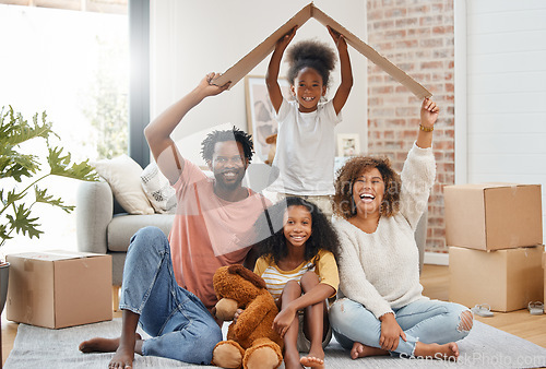 Image of Black family, floor and cardboard roof in new house for portrait, living room or games with laugh, bond or love. Father, mother and daughter for play, relax or box for sign of security in family home