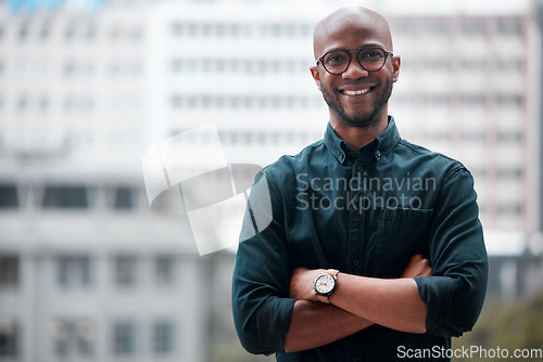 Image of Portrait, black man and arms crossed in office of business, corporate company or employee, worker in workplace. Happy, face and businessman with professional mindset, success in career or confidence