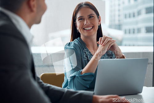 Image of Business meeting, woman and happy with laptop, working in company office, building or teamwork discussion. Female employee, manager or conversation with executive, ceo or feedback from boss