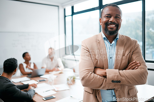 Image of Business, black man and smile in portrait with arms crossed, leadership and meeting with group for corporate project. Team leader, management and confidence with male person in conference room