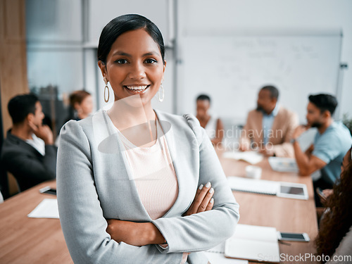 Image of Woman in business meeting, portrait and arms crossed with smile, leadership and group for corporate project. Team leader, manager and confidence, female person in conference room and professional