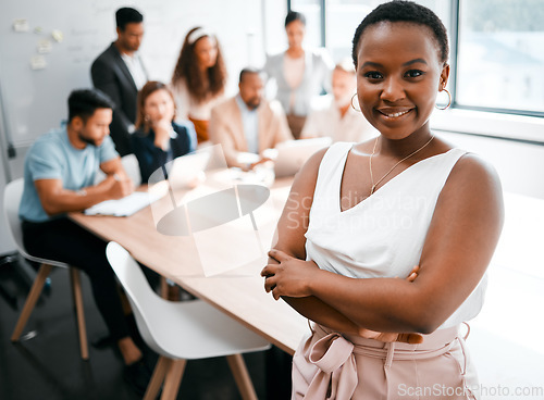 Image of Black woman in business, smile in portrait and arms crossed, leadership and meeting with company group. Team leader, manager and confidence with female person in conference room and professional