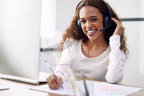 Image of Call center, portrait and woman writing notes for customer service, sales consulting and CRM in office. Happy female agent, consultant and contact us for telemarketing, online advice and telecom help