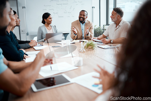 Image of Business people, meeting and idea for strategy in planning, brainstorming or coaching at the office. Group of employees in team discussion, collaboration or training staff in conference at workplace