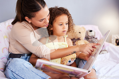 Image of Storytelling, book and mother with daughter in bedroom for teaching, fantasy or creative in bed. Education, learning and love with woman reading to relax girl in family home for fairytale, literature