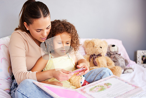 Image of Reading, book and storytelling with mother with daughter in bedroom for fairytale, fantasy or creative. Education, learning and love with woman and girl in family home for study, literature and relax