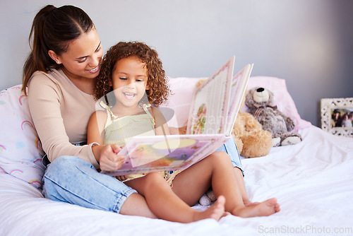 Image of Learning, book and mother with daughter in bedroom for storytelling, fantasy or creative. Education, study and love with woman reading to young girl in family home for fairytale, literature and relax