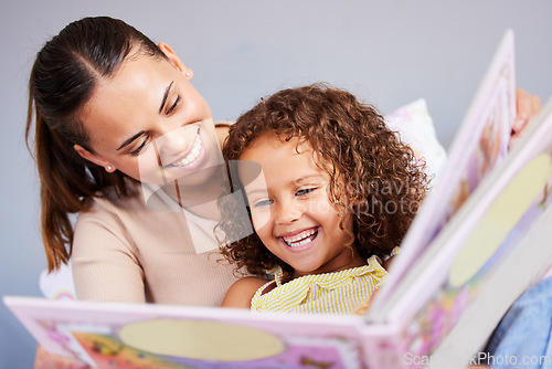 Image of Learning, book and mother with daughter in bedroom for storytelling, fantasy or creative. Education, study and love with woman reading to young girl in family home for fairytale, literature and relax