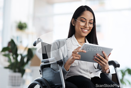 Image of Happy, reading and woman with a disability and a tablet for graphic design in the office. Smile, creative and a website designer in a wheelchair with technology for web and business analysis