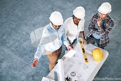 Image of Business people, architect and blueprint in meeting for construction, planning or collaboration with tablet mockup. Top view of group or engineering team in architecture project or floor plan on site