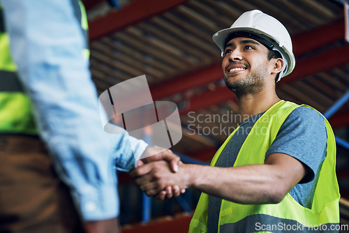 Image of Happy man, architect and handshake for construction, building or hiring in teamwork or partnership on site. Business people shaking hands in recruiting, architecture agreement or contractor deal