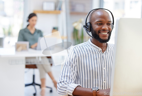 Image of Call center, computer and happy man, virtual consultant or advisor in customer support, online advice and office. contact, communication and business agent or african person on desktop in workspace