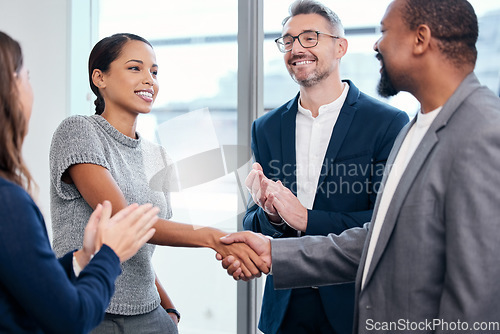Image of Business people, handshake and clapping in meeting celebration, success promotion or HR thank you. Corporate partnership, woman shaking hands and b2b onboarding, congratulations or career welcome