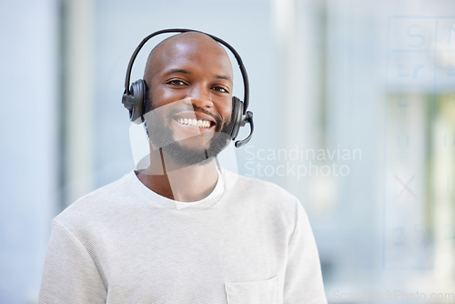 Image of Happy man, portrait and call center for virtual communication, business support or e learning services. Face of agent, black male advisor or person for consulting, agency space and crm chat advice