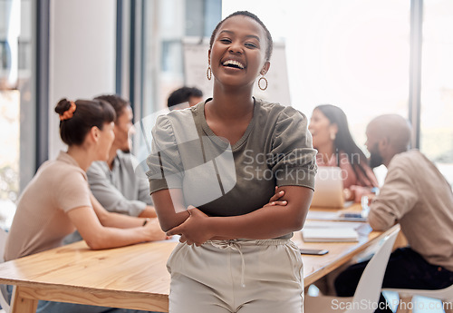 Image of Portrait, smile and black woman with arms crossed, startup success and teamwork in a modern office. Face, female person or leader with staff, manager or happiness with humor, meeting and professional