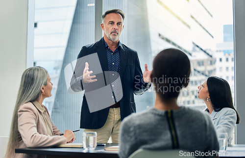 Image of Businessman, coaching and meeting in seminar for strategy, planning or team discussion at office. Man CEO, mentor or coach training staff in teamwork, project plan or ideas in conference at workplace