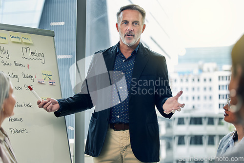 Image of Businessman, coaching and meeting on whiteboard for strategy, planning or team discussion at office. Man CEO, mentor or coach training staff in presentation for project plan or ideas at the workplace