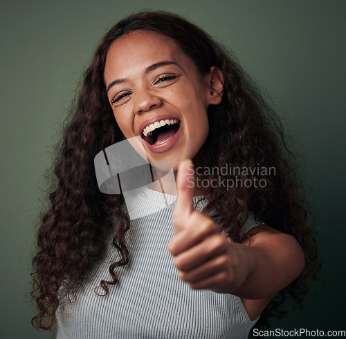 Image of Happy woman, thumbs up and hand gesture, emoji and agreement with feedback isolated on green background. Yes, like and thank you, excited female person smile, OK sign and support closeup in studio