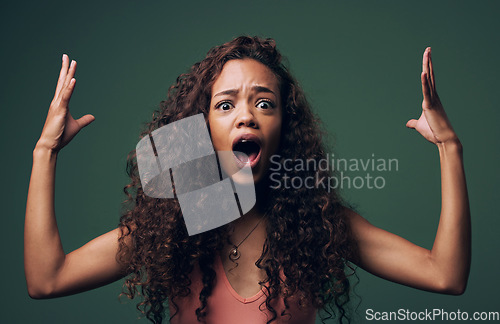 Image of Wow, wtf and portrait of woman mind blown in studio by news, gossip or drama on green background. Omg, face and female model shocked, surprise and confused with open mouth emoji, hands or expression