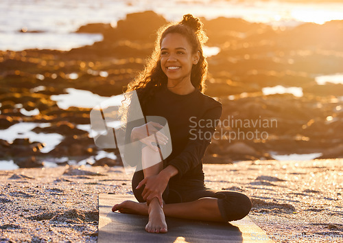 Image of Sunset, woman with yoga mat and at beach happy with a lens flare. Fitness or exercise, meditation or freedom and female person relax with smile for health wellness with sunlight outdoors for peace