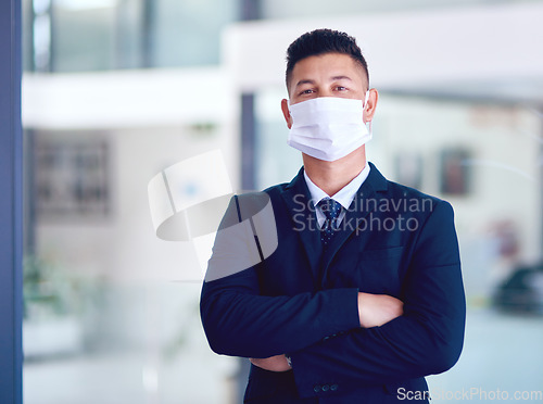 Image of Business man, face mask and portrait with arms crossed for company work, attorney and motivation. Success, male employee and professional lawyer in law firm at office with job pride and virus safety