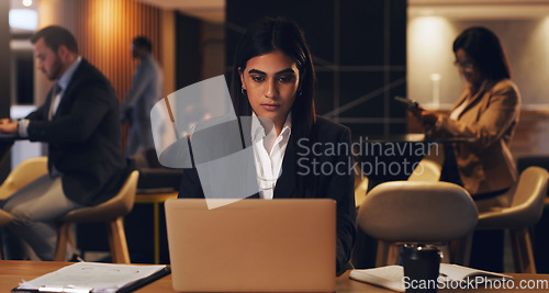 Image of Laptop, corporate lounge and woman reading stock exchange report, finance insight or financial trading analysis. Web review, night and overtime person doing research of online investment market