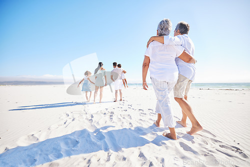 Image of Big family, sea or old couple walking with kids in summer with happiness, trust or peace in nature. Grandparents, back view or senior man bonding with woman or children taking a walk on beach sand