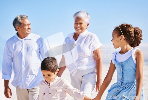 Image of Beach, grandparents or happy kids holding hands, walking or smiling in summer as a family in nature. Grandmother, senior grandfather or young children siblings bonding or taking walk together at sea