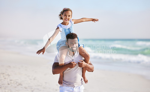 Image of Piggyback, sea or father walking with a child for a holiday vacation together with happiness in summer. Smile, fly or dad playing or enjoying family time with a happy girl or young kid on beach sand